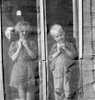 Farm Children, 1939. /Na Sister And Brother Standing Behind A Screen Door Of Their Farm Home In Dead Ox Flat, Malheur County, Oregon. Photograph By Dorothea Lange, October 1939. Poster Print by Granger Collection - Item # VARGRC0123518