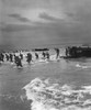 World War Ii: Training. /Namerican Troops Leap Off A U.S. Coast Guard Landing Craft To Storm A North African Beach During Maneuvers To Prepare For The Invasion Of Normandy, 1944. Poster Print by Granger Collection - Item # VARGRC0167143