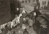 Hine: Mill Housing, 1912. /Ntextile Mill Worker'S Family In The Yard With A Clothesline Covered With Laundry In Providence, Rhode Island. Photograph By Lewis Hine, November 1912. Poster Print by Granger Collection - Item # VARGRC0167547