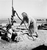 Water Pump, 1939. /Na Farm Wife And Child Pumping Water From A Well On A Farm In Malheur County, Oregon. Photograph By Dorothea Lange, October 1939. Poster Print by Granger Collection - Item # VARGRC0123520