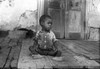 Poverty: Child, 1938. /Nan Impovished African American Boy Seated On A Dilapidated Porch On The Trepagnier Plantation Near Norco, Louisiana. Photograph By Russell Lee, September 1938. Poster Print by Granger Collection - Item # VARGRC0121650