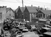 Milwaukee: Auto Parts, 1936. /Na Junkyard With Auto Parts And Scrap Metal Alongside Working Class Houses, Milwaukee, Wisconsin. Photograph By Carl Mydans, April 1936. Poster Print by Granger Collection - Item # VARGRC0121104