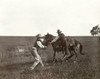 Texas: Cowboys, C1908. /Na Cowboy Trying To Mount A Bronco While Another Cowboy Holds The Horse By The Reins In Texas. Photograph By Erwin Evans Smith, C1908. Poster Print by Granger Collection - Item # VARGRC0124935