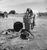 Migrant Camp, 1937. /Na Woman Washing Clothes In A Washbin At A Camp For Migrant Workers Near Calipatria, Imperial Valley, California. Photograph By Dorothea Lange, 1937. Poster Print by Granger Collection - Item # VARGRC0123694