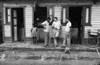 Peace Corps, C1965. /Npeace Corps Volunteer Kirby Jones Standing With Others Outside Of A General Store In Santo Domingo, Dominican Republic. Photograph, C1965. Poster Print by Granger Collection - Item # VARGRC0175273