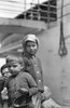 Ellis Island: Immigrants. /Nyoung Boy And Girl Standing Before A Steamer At Ellis Island, New York, C1914. Poster Print by Granger Collection - Item # VARGRC0117528