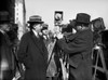 Photographers, 1922. /Namerican Politician And Lawyer Will Hays (Left) Watches A Photographer Load A Movie Camera, In Washington, D.C., 1922. Poster Print by Granger Collection - Item # VARGRC0126309