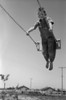 Swing, C1940. /Na Boy On A Swingset. Photograph, C1940. Poster Print by Granger Collection - Item # VARGRC0322255