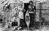 Menominee Couple, 1908. /Na Menominee Native American Couple Standing Outside A Bark House In Northeastern Wisconsin. Photographed By Arthur J. Kingsbury, 1908. Poster Print by Granger Collection - Item # VARGRC0172696