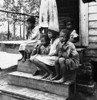 Rural Children, 1936. /Nimpoverished African American Children Of A Turpentine Worker Seated On The Steps Of A Porch Near Cordele, Alabama. Photograph By Dorothea Lange, July 1936. Poster Print by Granger Collection - Item # VARGRC0123799
