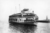 Ellis Island Ferry, C1920. /Nthe Ferry Taking Immigrants From Ellis Island To Lower Manhattan, Passing The Statue Of Liberty, C1920. Poster Print by Granger Collection - Item # VARGRC0125106