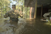 A US Marine wades through waist deep flood water during Hurricane Harvey Poster Print by Stocktrek Images - Item # VARPSTSTK108916M