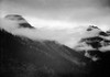 Veiled Mountains, Glacier National Park, Montana - National Parks and Monuments, 1941 Poster Print by Ansel Adams - Item # VARPDX460724
