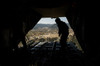 US Air Force Airman pushes out pallets from a C-130H Hercules Poster Print by Stocktrek Images - Item # VARPSTSTK106671M