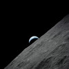 The crescent Earth rises above the lunar horizon Poster Print by Stocktrek Images - Item # VARPSTSTK202771S