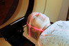 Lasers used to position a patient wearing a short face mask in a computed tomography scanner Poster Print by National Institutes of Health/Stocktrek Images - Item # VARPSTNIH700045H