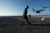 Aviation Boatswain's Mate prepares to chock and chain an MV-22 Osprey Poster Print by Stocktrek Images - Item # VARPSTSTK107528M