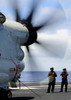 Sailors monitor an E2-C Hawkeye on the flight deck of USS Nimitz Poster Print by Stocktrek Images - Item # VARPSTSTK106443M