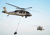 Helicopters carry munitions to the flight deck of aircraft carrier USS Abraham Lincoln Poster Print by Stocktrek Images - Item # VARPSTSTK101165M