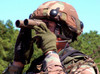 A soldier scans an area for enemy forces Poster Print by Stocktrek Images - Item # VARPSTSTK101562M