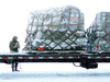 Airman braves blowing snow on the flightline while preparing pallets of equipment Poster Print by Stocktrek Images - Item # VARPSTSTK100721M
