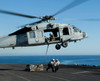 An MH-60S Sea Hawk helicopter prepares to lift crates from USS Makin Island Poster Print by Stocktrek Images - Item # VARPSTSTK106639M