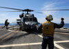Airman signals to an MH-60S Sea Hawk helicopter aboard USS Momsen Poster Print by Stocktrek Images - Item # VARPSTSTK105609M