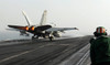 An F/A-18C Hornet launches from the flight deck of USS Abraham Lincoln Poster Print by Stocktrek Images - Item # VARPSTSTK106489M