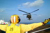 A signalman guides a MH-60S Seahawk helicopter in for a landing Poster Print by Stocktrek Images - Item # VARPSTSTK100878M