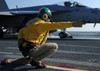 A shooter signals the launch of an F/A-18 Super Hornet Poster Print by Stocktrek Images - Item # VARPSTSTK104343M