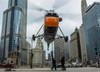 An S-58T helicopter comes down to street level in Chicago, Illinois Poster Print by Rob Edgcumbe/Stocktrek Images - Item # VARPSTRDG100003M