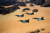 Military planes flying over the Wadi Rum desert in Jordan Poster Print by Stocktrek Images - Item # VARPSTSTK108297M