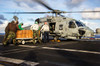 Sailors load relief supplies onto an MH-60S Sea Hawk Poster Print by Stocktrek Images - Item # VARPSTSTK108550M