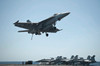 An F/A-18E Super Hornet flies over the flight deck of USS Nimitz Poster Print by Stocktrek Images - Item # VARPSTSTK107614M