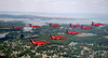 A F-22 Raptor flies in formation with the Royal Air Force Aerobatic Team, The Red Arrows Poster Print by Stocktrek Images - Item # VARPSTSTK102739M