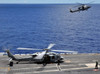 SH-60 Sea Hawk helicopters land aboard the aircraft carrier USS Ronald Reagan Poster Print by Stocktrek Images - Item # VARPSTSTK103802M