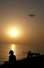 A Sailor watches an E-2C Hawkeye fly from USS George Washington Poster Print by Stocktrek Images - Item # VARPSTSTK100556M