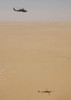 An SH-60B Seahawk flies over Kuwait during a training flight Poster Print by Stocktrek Images - Item # VARPSTSTK100619M