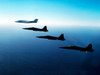 Three F-5E Tiger IIs fly in formation with a Learjet 25 Poster Print by Dave Baranek/Stocktrek Images - Item # VARPSTDBR100007M