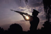 A US Marine Honor Guard rifleman performs a gun salute during sunset Poster Print by Michael Wood/Stocktrek Images - Item # VARPSTWOD100085M