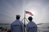 Sailors stand by to lower the ensign on USS John C Stennis Poster Print by Stocktrek Images - Item # VARPSTSTK105585M