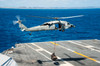 An MH-60S Sea Hawk delivers supplies onto the flight deck of USS George Washington Poster Print by Stocktrek Images - Item # VARPSTSTK108110M