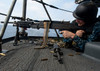 A Sailor fires an M-240B machine gun aboard USS Enterprise Poster Print by Stocktrek Images - Item # VARPSTSTK106376M