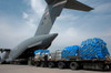 A Japanese soldier marshals vehicles from a C-17 Globemaster III Poster Print by Stocktrek Images - Item # VARPSTSTK104201M