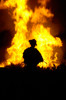 US Army Sergeant monitors the flames of a fire around a canal Poster Print by Stocktrek Images - Item # VARPSTSTK102791M
