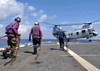 Sailors rush to chock and chain a CH-46E Sea Knight helicopter Poster Print by Stocktrek Images - Item # VARPSTSTK103915M