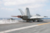 An F/A-18F Super Hornet launches from the flight deck of USS George Washington Poster Print by Stocktrek Images - Item # VARPSTSTK108138M