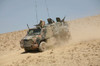 Dutch military vehicle driving down a dirt hill in Afghanistan Poster Print by VWPics/Stocktrek Images - Item # VARPSTVWP100232M