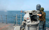 Gunner's Mate fires a 25mm chain gun aboard USS Cape St George Poster Print by Stocktrek Images - Item # VARPSTSTK106190M