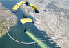 Members of the US Navy parachute team above Naval Amphibious Base Coronado Poster Print by Stocktrek Images - Item # VARPSTSTK104233M